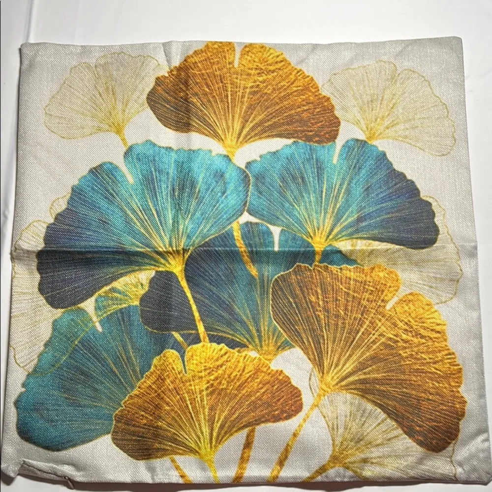 Floral Patterned outdoor waterproof throw pillow with Blue and Yellow Leaves.